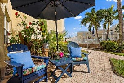 birds eye view of property with a water view and a view of the beach