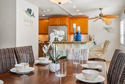 dining space featuring hardwood / wood-style floors and ceiling fan