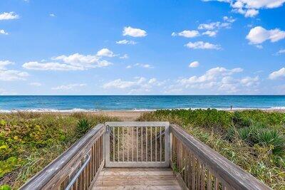 property view of water featuring a beach view