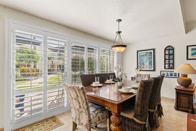 dining area featuring light tile patterned floors