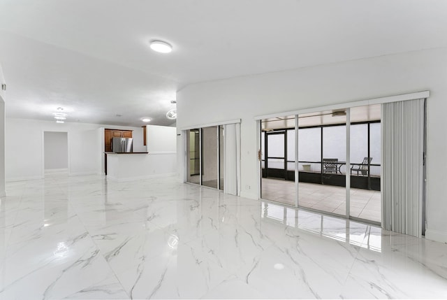 empty room featuring vaulted ceiling