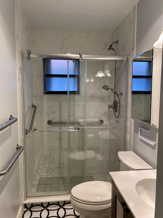 bathroom featuring toilet, vanity, and walk in shower