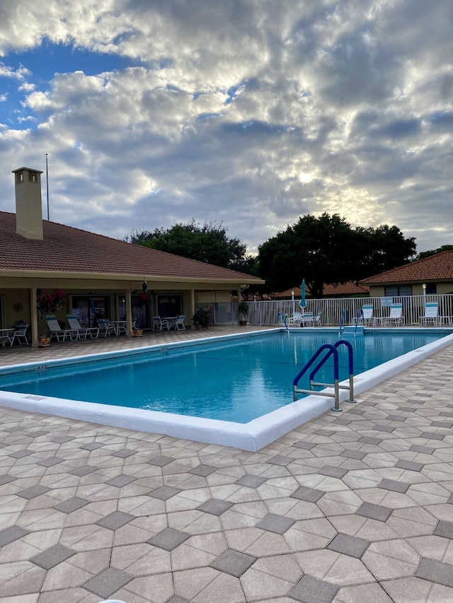 view of swimming pool featuring a patio