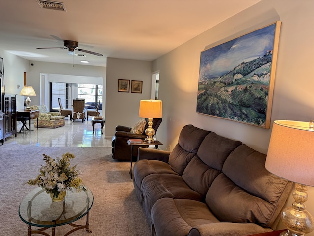 living room with light colored carpet and ceiling fan