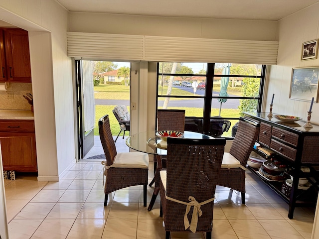 dining room featuring a wealth of natural light and light tile patterned floors