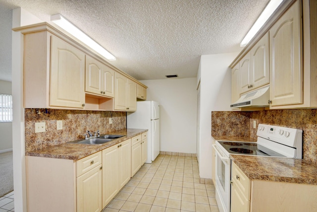 kitchen with sink, backsplash, a textured ceiling, white appliances, and light tile patterned floors