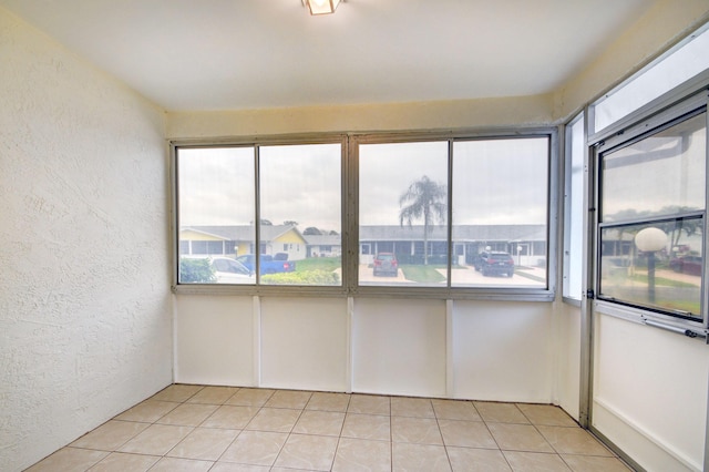 empty room with light tile patterned floors