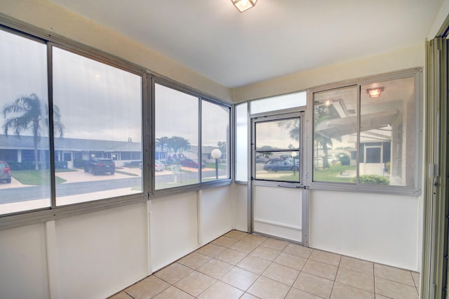 unfurnished sunroom featuring a healthy amount of sunlight