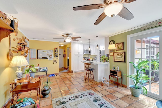 living room with crown molding and light tile patterned floors