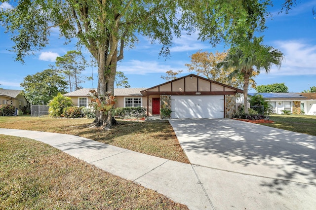 ranch-style home with a front yard and a garage