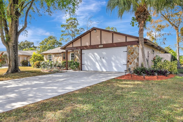 view of front of home featuring a front yard and a garage