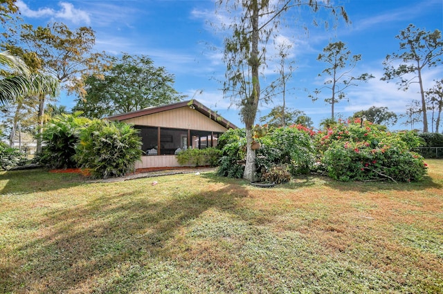 view of yard featuring a sunroom