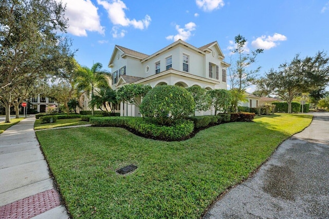 view of side of home featuring a lawn