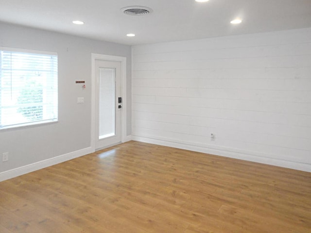 spare room featuring light wood-type flooring