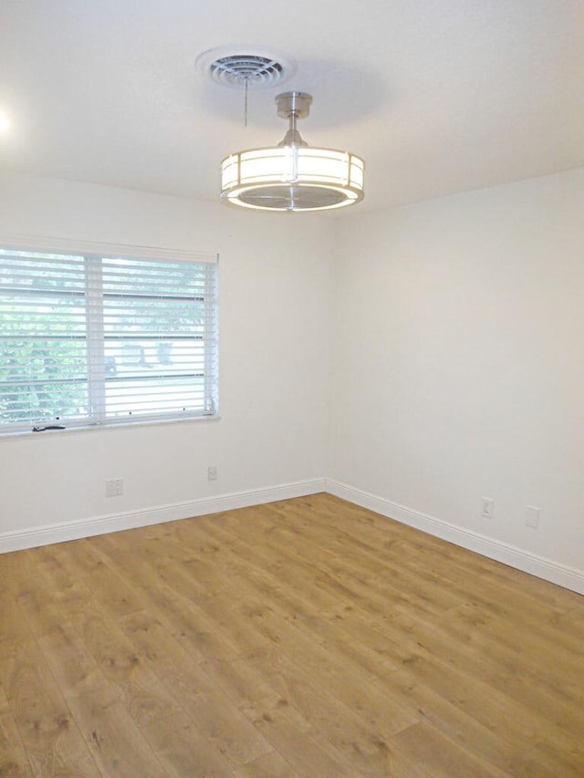 empty room with light wood-type flooring