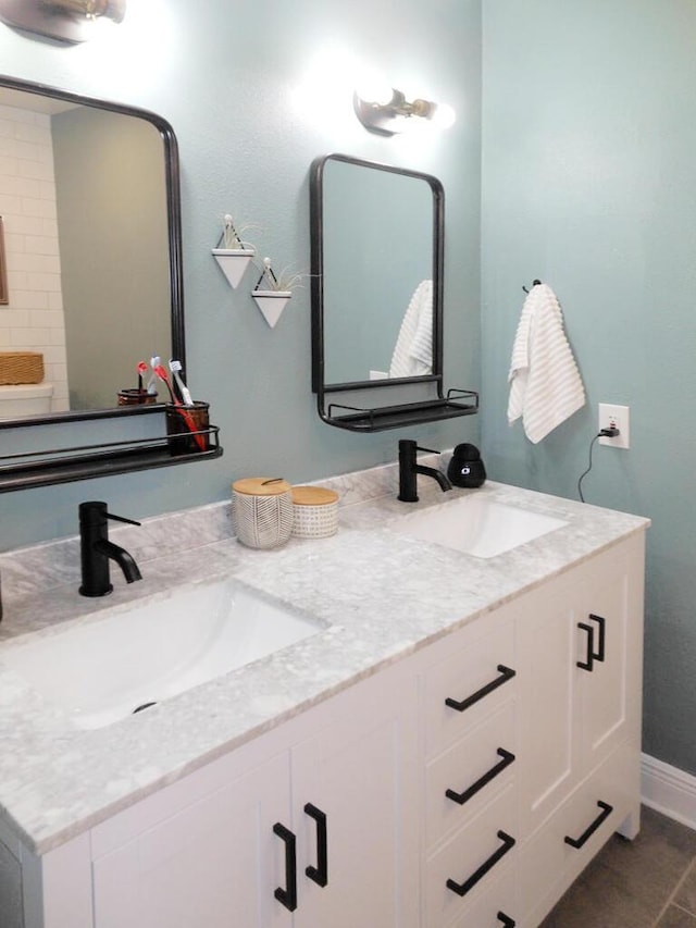 bathroom featuring vanity and tile patterned flooring