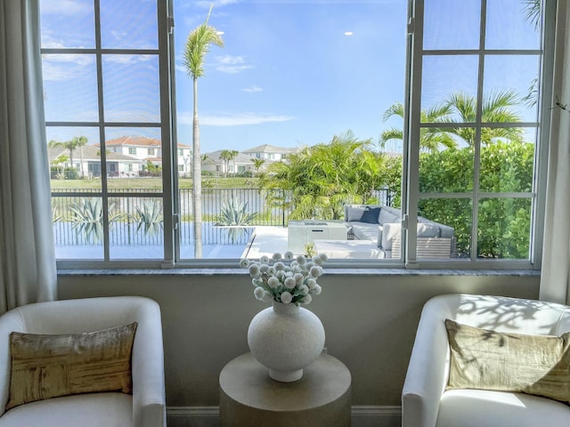 interior space with a wealth of natural light and a water view