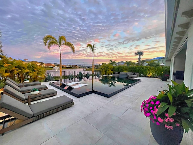 view of patio terrace at dusk