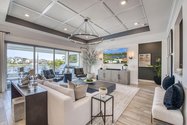 living room featuring an inviting chandelier, light hardwood / wood-style floors, coffered ceiling, and beamed ceiling