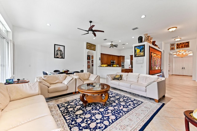 tiled living room featuring ceiling fan