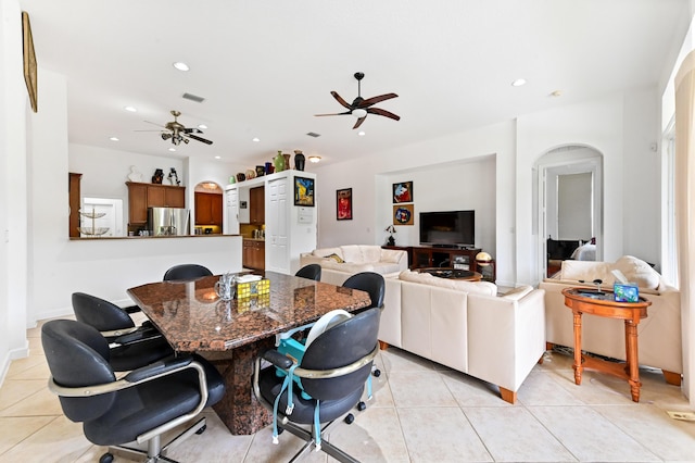 dining room with ceiling fan and light tile patterned floors