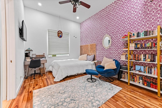 bedroom with wood-type flooring and ceiling fan