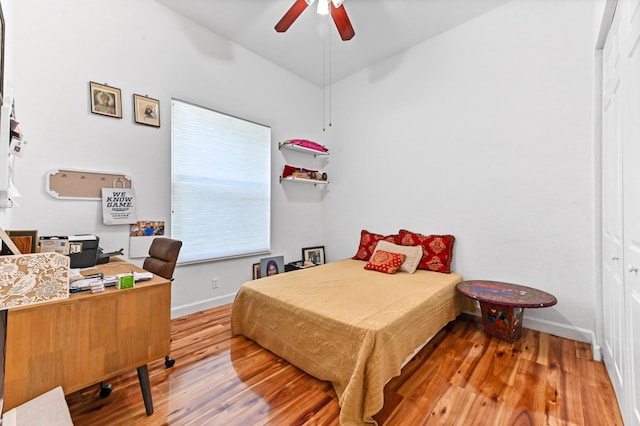 bedroom with hardwood / wood-style floors and ceiling fan