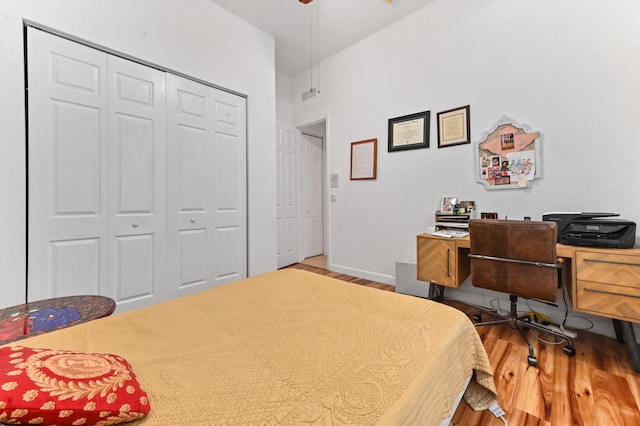 bedroom featuring hardwood / wood-style flooring and a closet