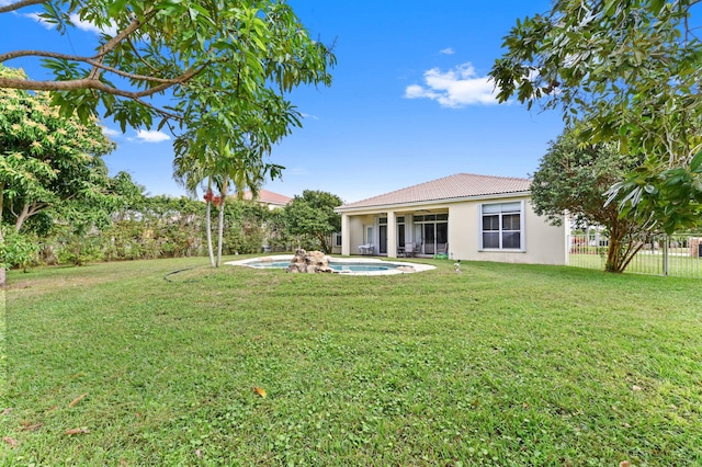 view of yard with a fenced in pool