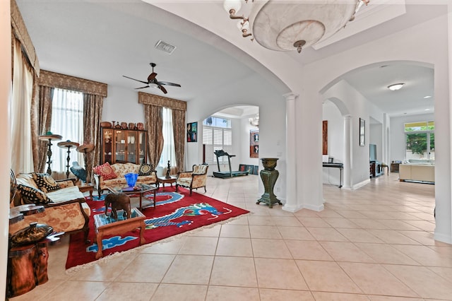 tiled entryway featuring ceiling fan