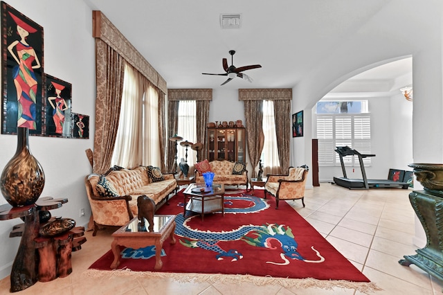 living room with ceiling fan and light tile patterned floors