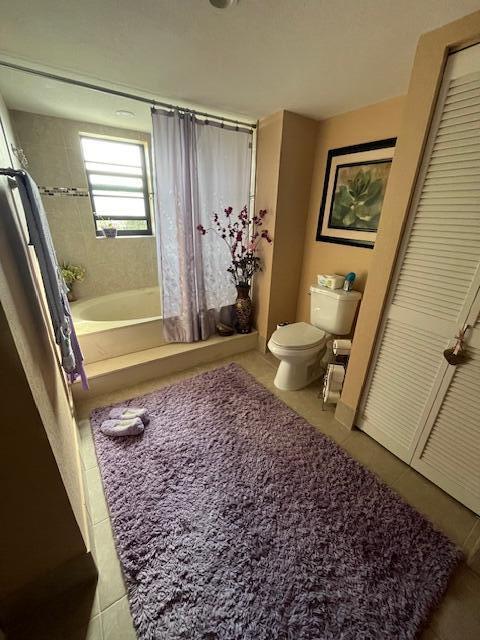 bathroom with plus walk in shower and toilet