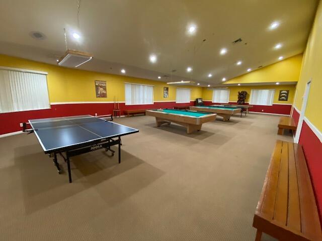 playroom featuring carpet floors, lofted ceiling, and pool table