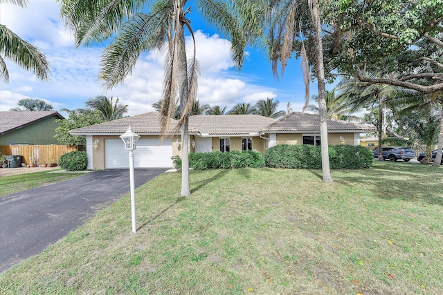 ranch-style home with a front yard and central AC unit