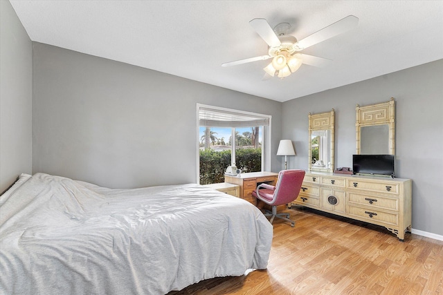 bedroom with ceiling fan and light hardwood / wood-style flooring