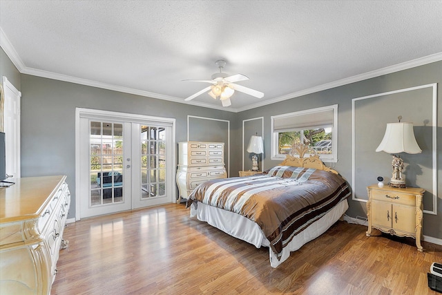 bedroom with ceiling fan, french doors, access to outside, and multiple windows