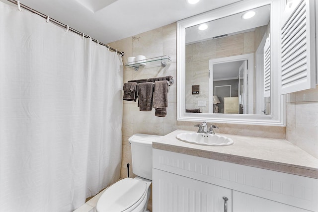 bathroom featuring toilet and vanity