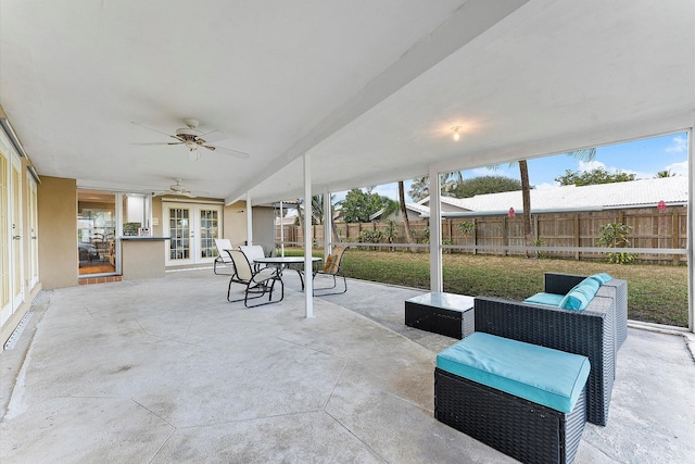 view of patio / terrace with ceiling fan, french doors, and an outdoor living space