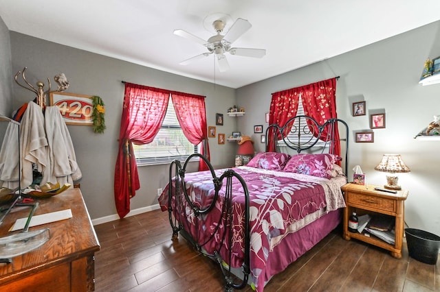 bedroom featuring dark hardwood / wood-style flooring and ceiling fan