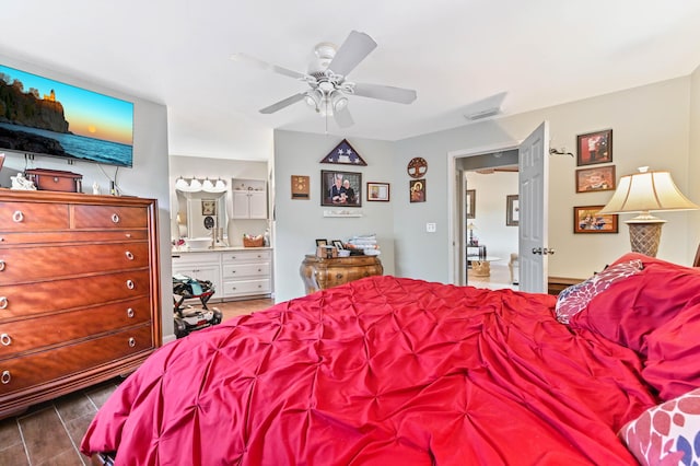 bedroom featuring ceiling fan and ensuite bathroom