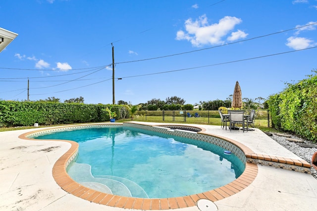 view of swimming pool with a patio area