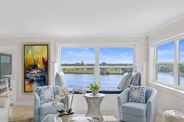 sunroom / solarium with a water view