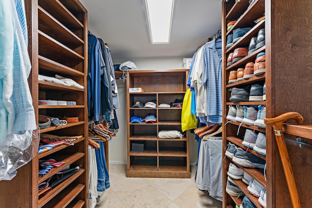 spacious closet featuring light tile patterned flooring