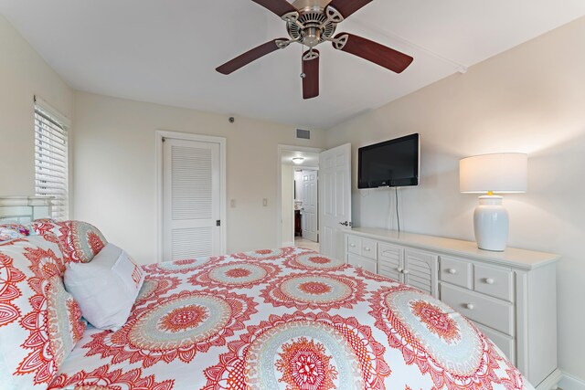 bedroom featuring ceiling fan and a closet