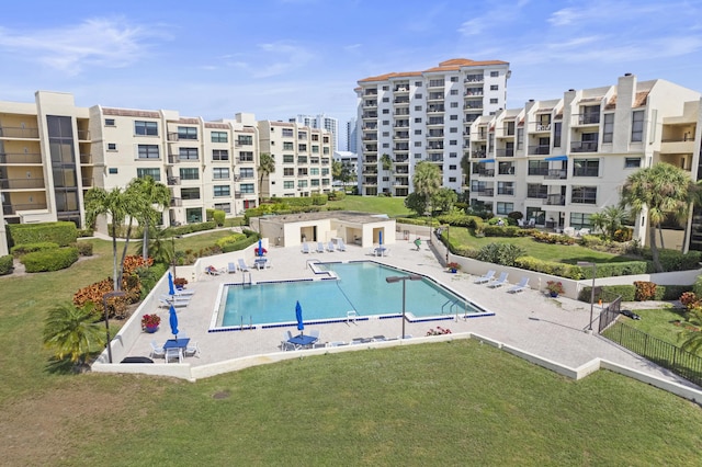 view of pool featuring a patio area and a lawn