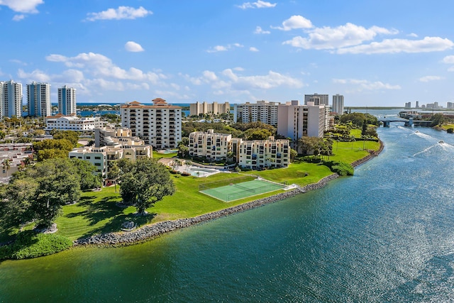 birds eye view of property with a water view