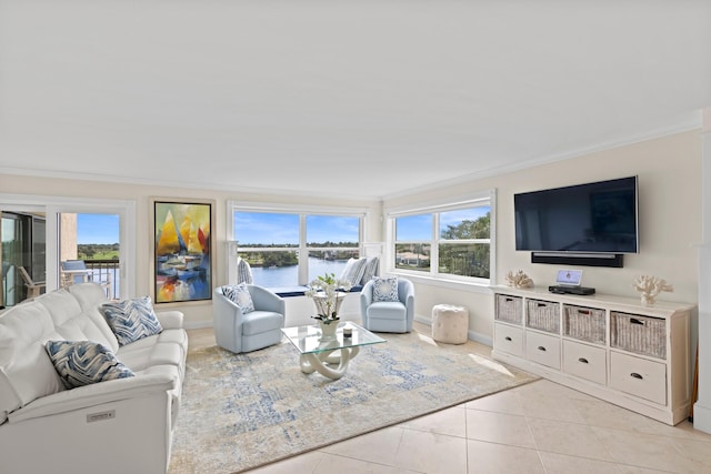 living room featuring light tile patterned floors, crown molding, and a wealth of natural light