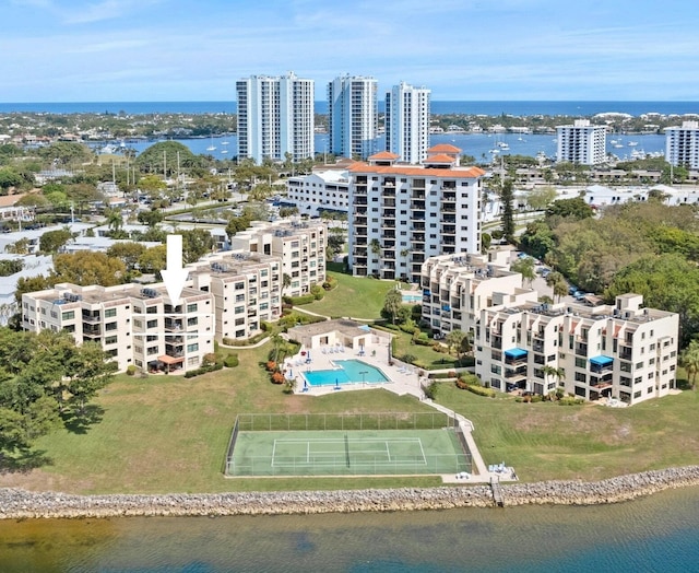 birds eye view of property with a water view