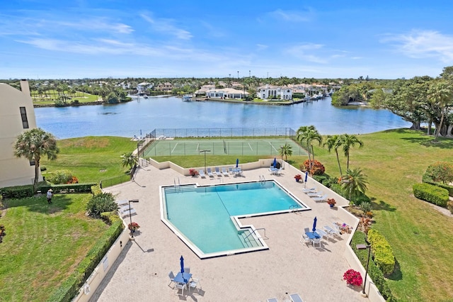 view of pool with a water view