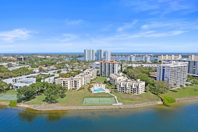 birds eye view of property with a water view